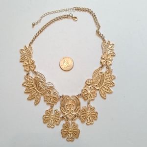 Floral & lace like gold tone statement necklace
